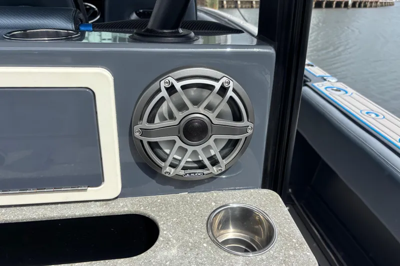 Slide: The Image of 2016 Hydra-Sports 4200 Siesta boat interior with JL Audio speaker and cup holder. - 50