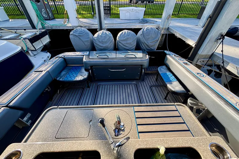 Slide: The Image of 2016 Hydra-Sports 4200 Siesta boat interior with seating and covered engines. - 51