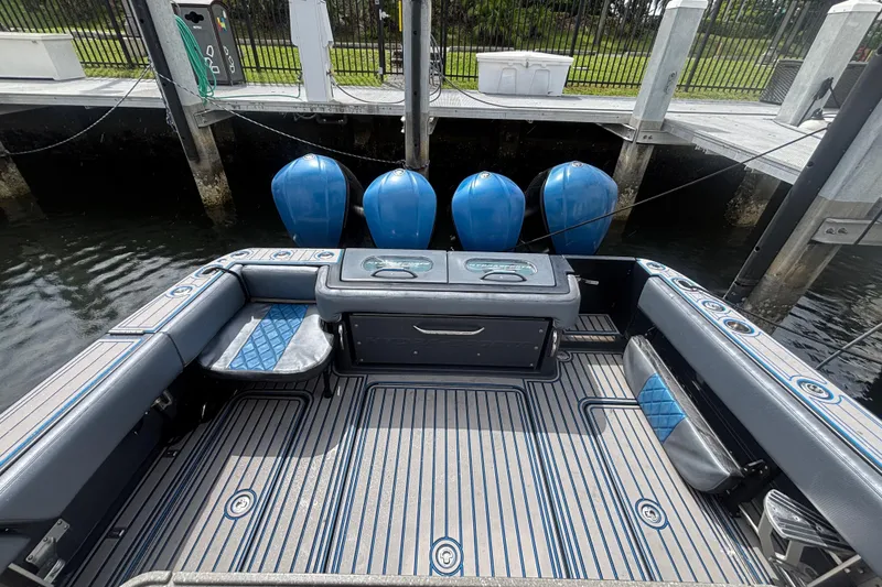 Slide: The Image of 2016 Hydra-Sports 4200 Siesta boat interior with seating and storage at dock. - 52