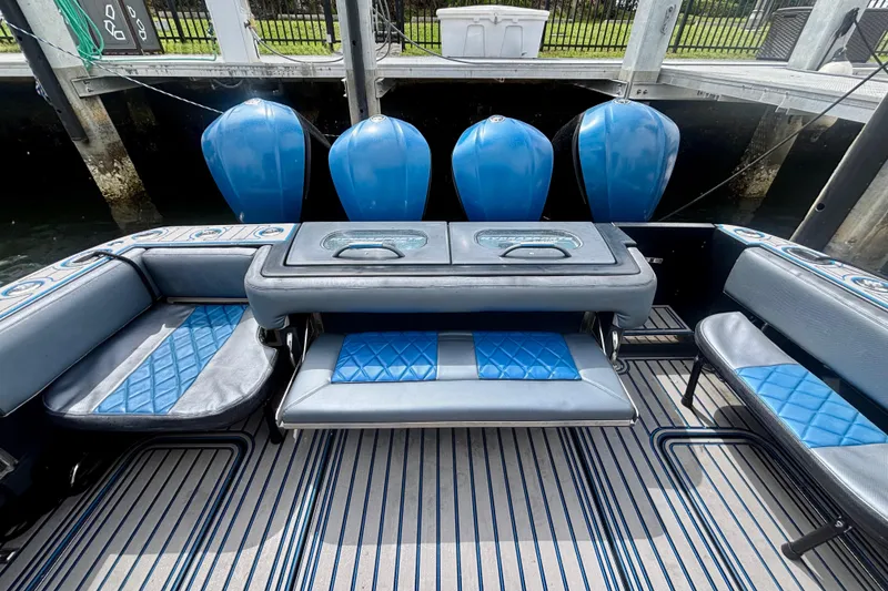 Slide: The Image of 2016 Hydra-Sports 4200 Siesta boat interior with blue seating and outboard motors. - 53