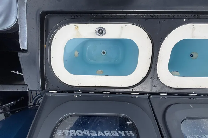 Slide: The Image of Livewell compartments on a 2016 Hydra-Sports 4200 Siesta boat. - 63
