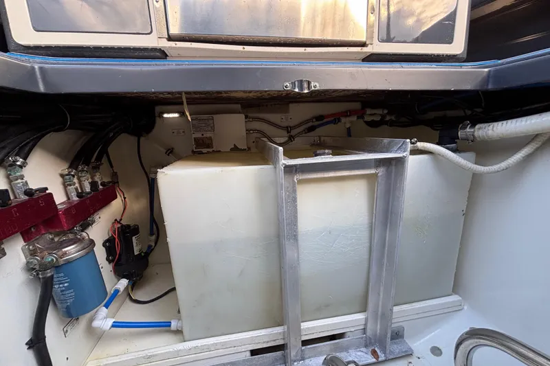 Slide: The Image of 2016 Hydra-Sports 4200 Siesta engine compartment with fuel tank and wiring. - 73