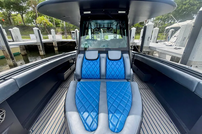 Slide: The Image of 2016 Hydra-Sports 4200 Siesta boat interior with blue diamond-stitched seating. - 8