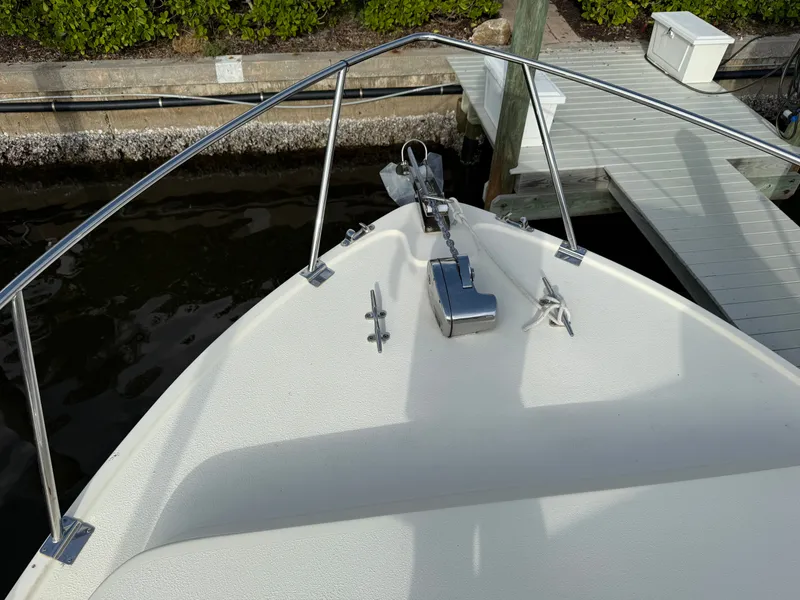 Slide: The Image of Bow of a 2018 Eastern 27 Islander Hardback boat at dock. - 12