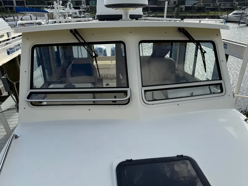 Slide: The Image of 2018 Eastern 27 Islander Hardback boat at dock. - 13