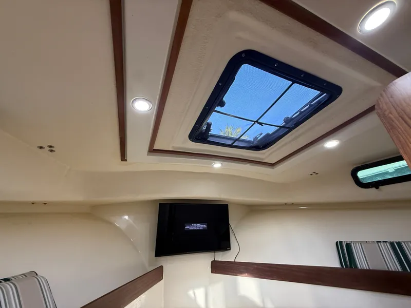 Slide: The Image of Interior of 2018 Eastern 27 Islander Hardback with skylight and TV. - 20