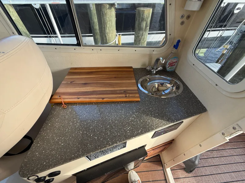 Slide: The Image of Galley area on a 2018 Eastern 27 Islander Hardback boat. - 21