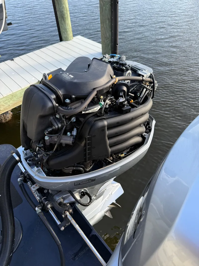 Slide: The Image of Outboard motor of a 2018 Eastern 27 Islander Hardback at dock. - 45