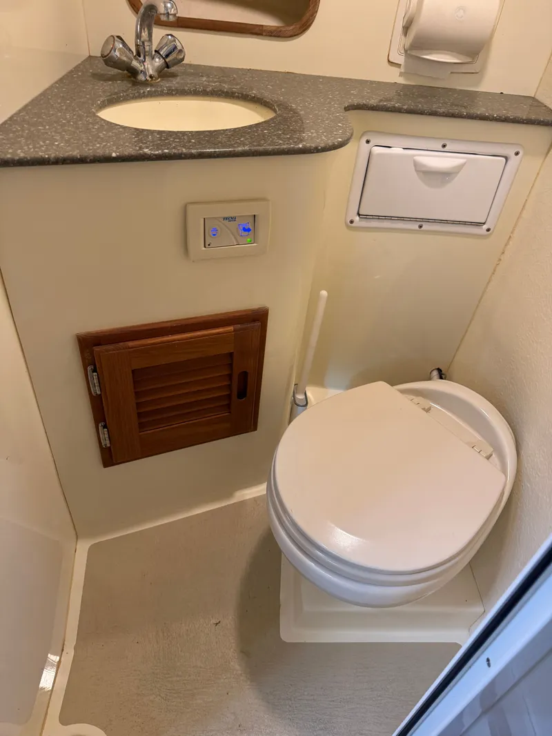 Slide: The Image of Eastern 27 Islander Hardback 2018 bathroom with toilet and sink. - 28