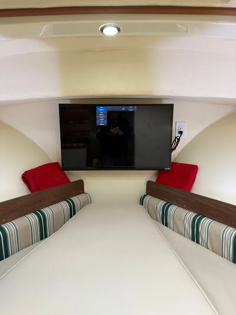 Slide: The Image of Interior of 2018 Eastern 27 Islander Hardback with TV and seating area. - 30