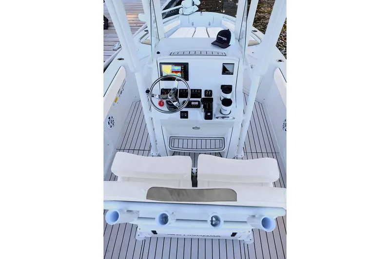 Slide: The Image of Manufacturer Provided Image: 2025 Stingray 216 CC boat cockpit with steering wheel and controls. - 15