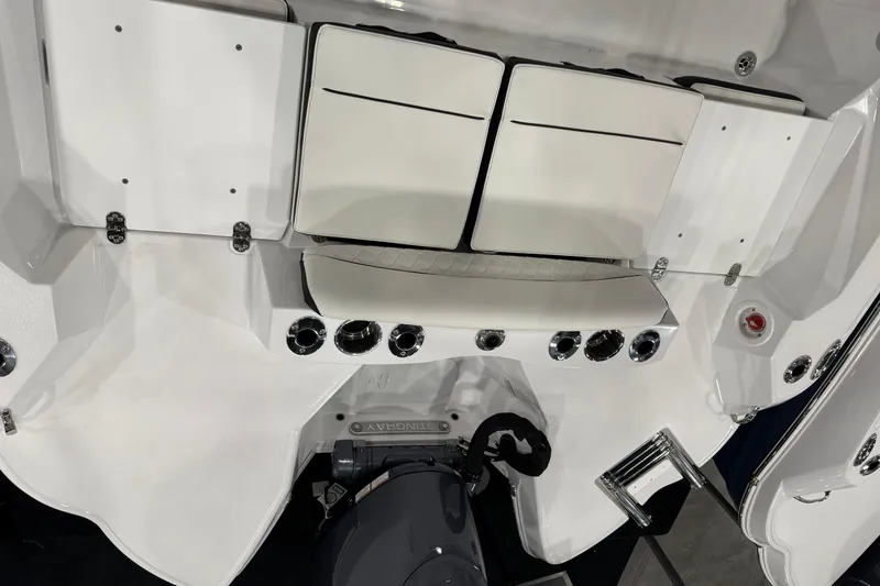 Slide: The Image of 2026 Stingray 216 CC boat interior with seating and control panel. - 3