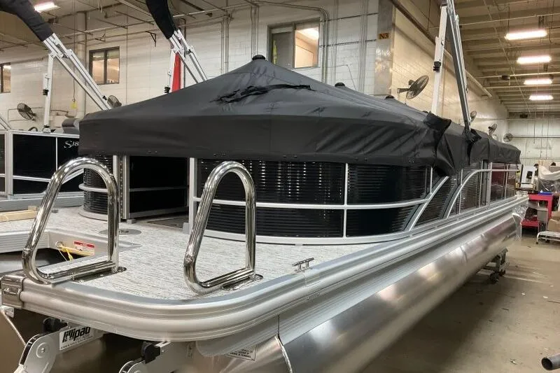Slide: The Image of 2026 Bennington 24SXSR pontoon boat in a workshop. - 11