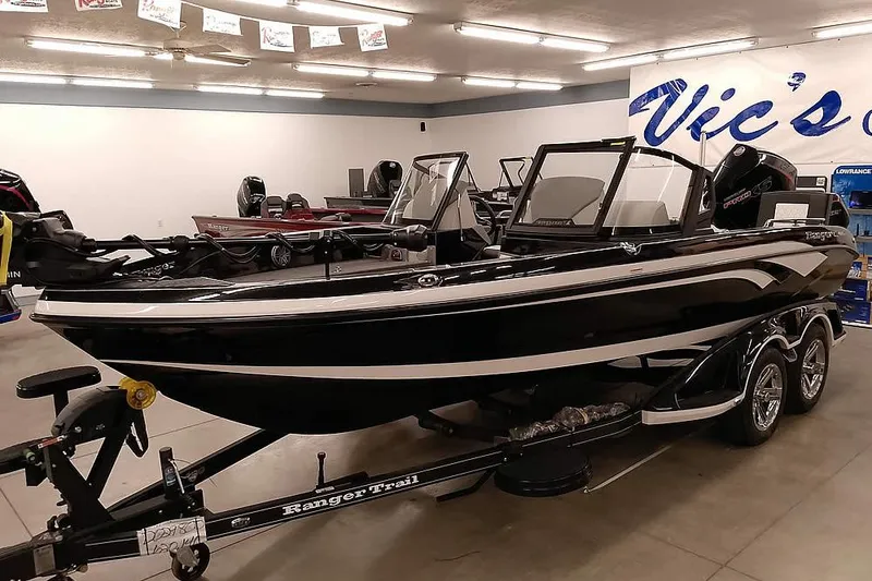 The Image of 2026 Ranger 620xFS Pro boat displayed indoors on a trailer. - 0