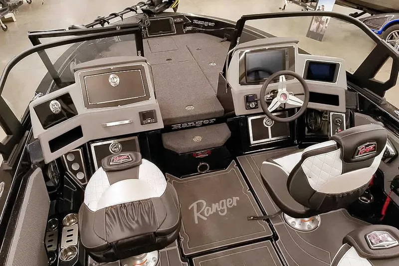 Slide: The Image of 2026 Ranger 620xFS Pro boat interior with modern dashboard and seating. - 11