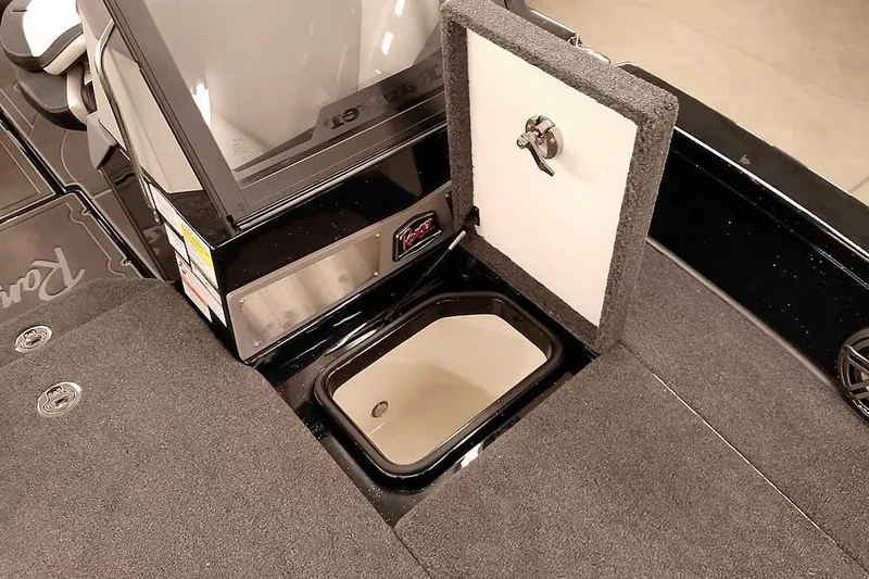 Slide: The Image of 2026 Ranger 620xFS Pro boat interior with open storage compartment. - 16