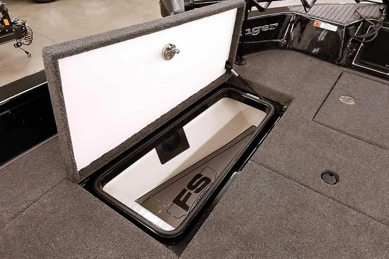 Slide: The Image of 2026 Ranger 620xFS Pro boat storage compartment with open lid, showcasing interior design. - 17