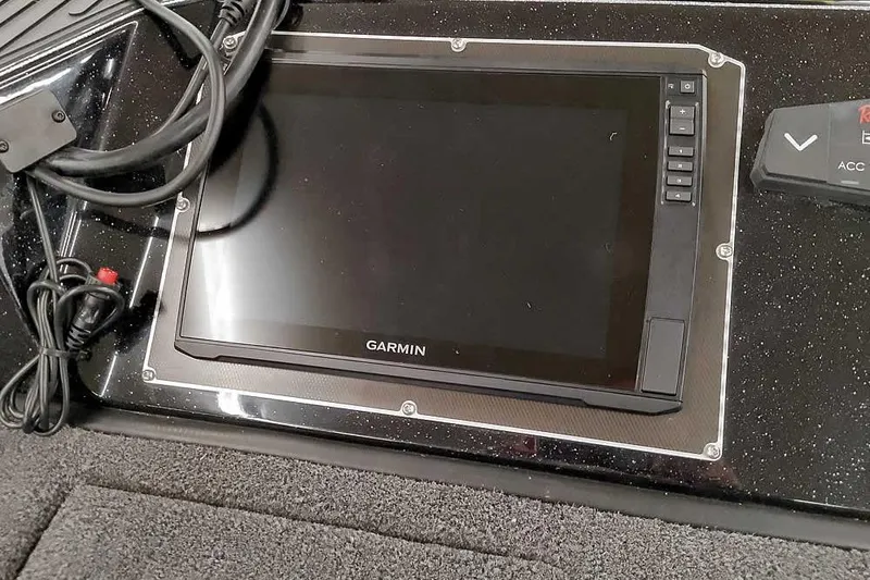 Slide: The Image of Garmin display on 2026 Ranger 620xFS Pro boat dashboard with cables. - 19