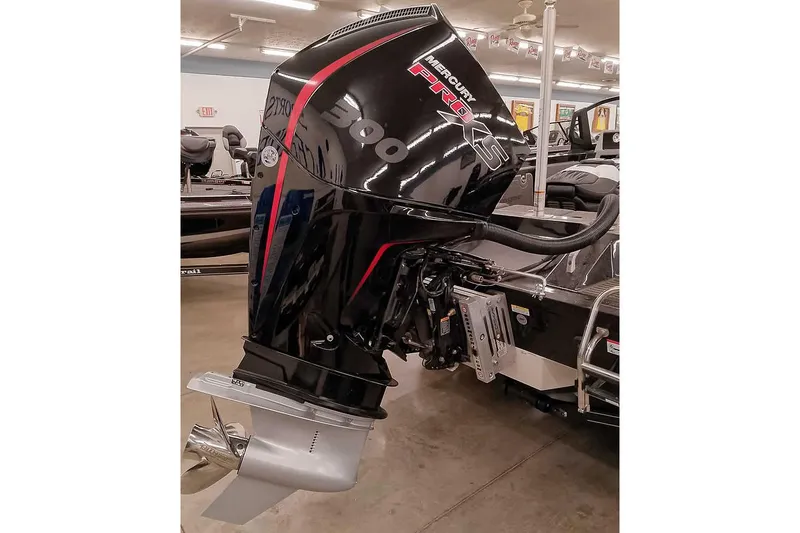 Slide: The Image of 2026 Ranger 620xFS Pro with Mercury Pro XS 300 outboard motor in showroom. - 2