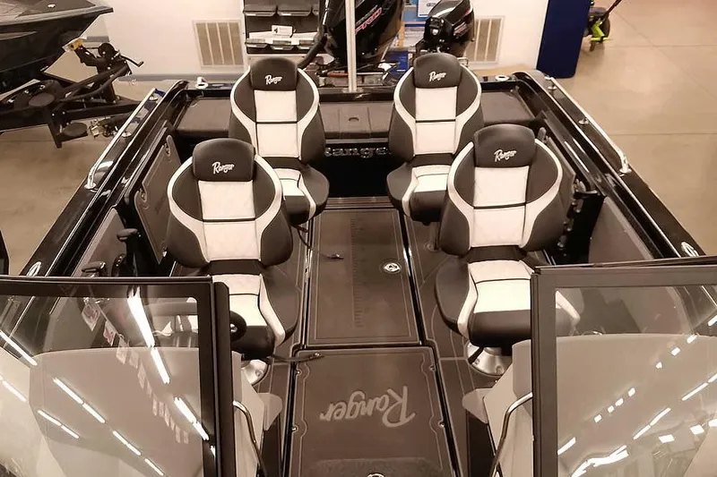Slide: The Image of 2026 Ranger 620xFS Pro boat interior with four black and white seats. - 20
