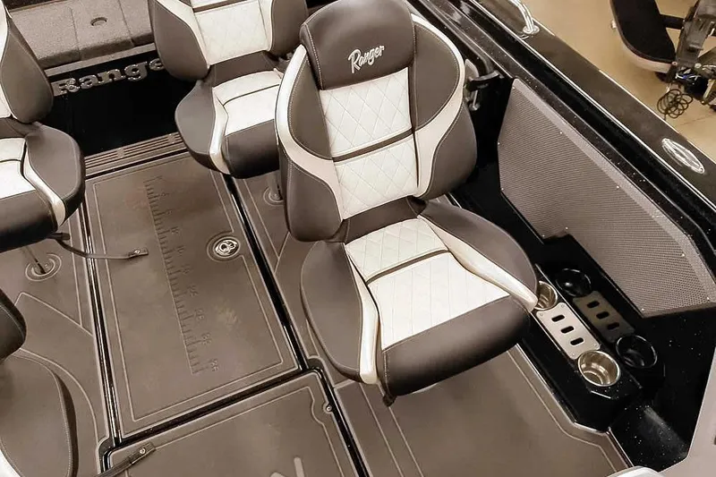 Slide: The Image of 2026 Ranger 620xFS Pro boat interior with premium seating and storage compartments. - 21