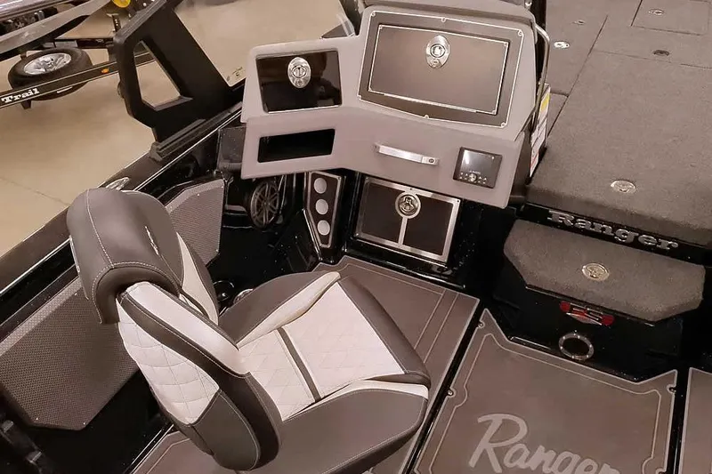 Slide: The Image of 2026 Ranger 620xFS Pro boat interior with modern dashboard and comfortable seating. - 22