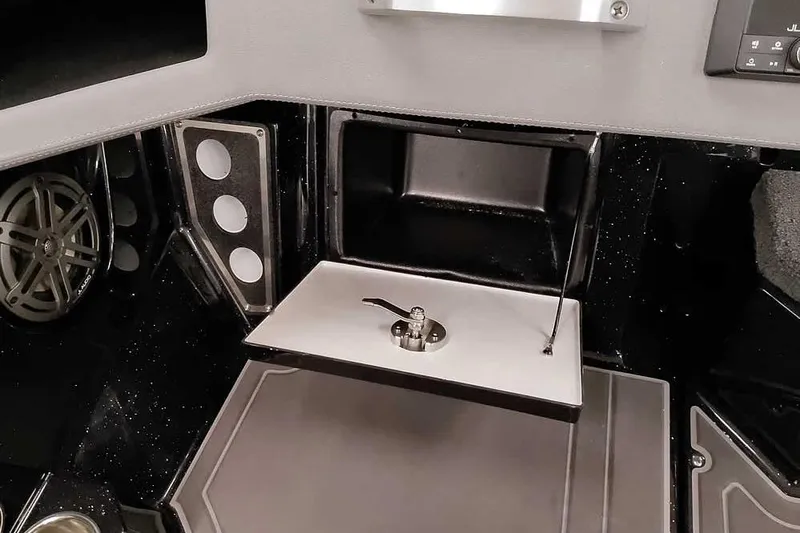 Slide: The Image of 2026 Ranger 620xFS Pro interior detail with storage compartment and speaker system. - 23