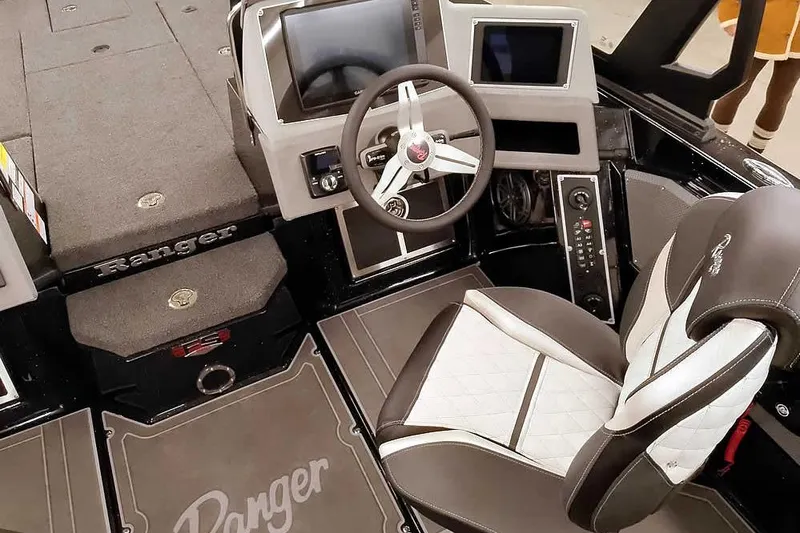 Slide: The Image of 2026 Ranger 620xFS Pro boat interior with modern dashboard and comfortable seating. - 26