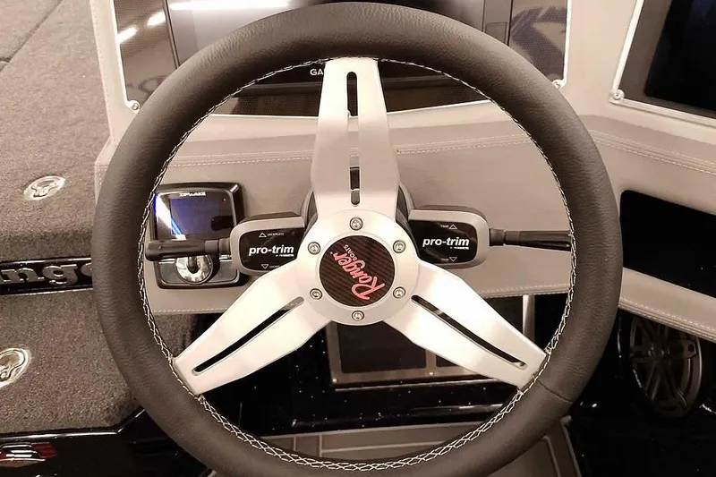 Slide: The Image of Steering wheel of 2026 Ranger 620xFS Pro boat with pro-trim controls. - 28
