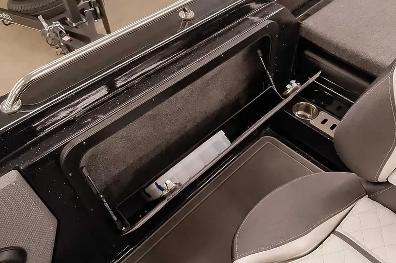 Slide: The Image of 2026 Ranger 620xFS Pro boat interior with storage compartment and seating. - 33