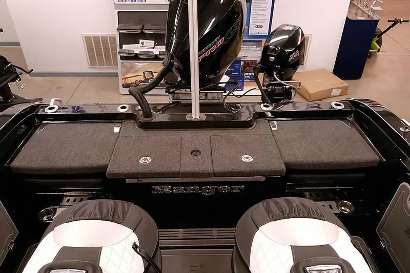 Slide: The Image of 2026 Ranger 620xFS Pro boat interior with dual motors and seating. - 36