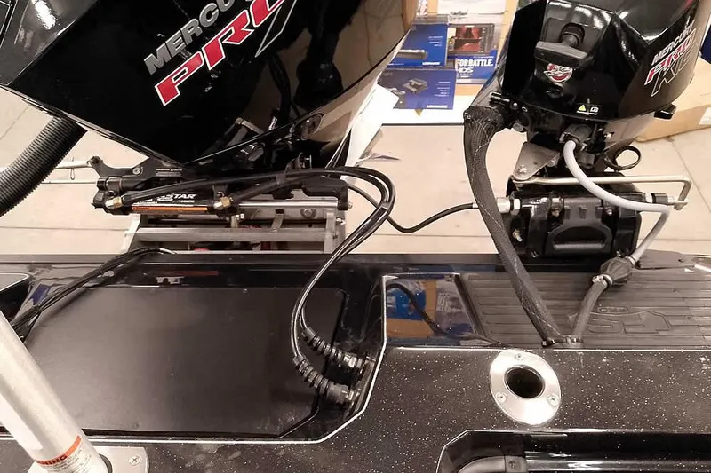 Slide: The Image of Ranger 620xFS Pro 2026 boat with dual Mercury Pro outboard motors. - 42