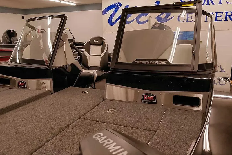 Slide: The Image of 2026 Ranger 620xFS Pro boat interior with dual windshields and Garmin equipment. - 9
