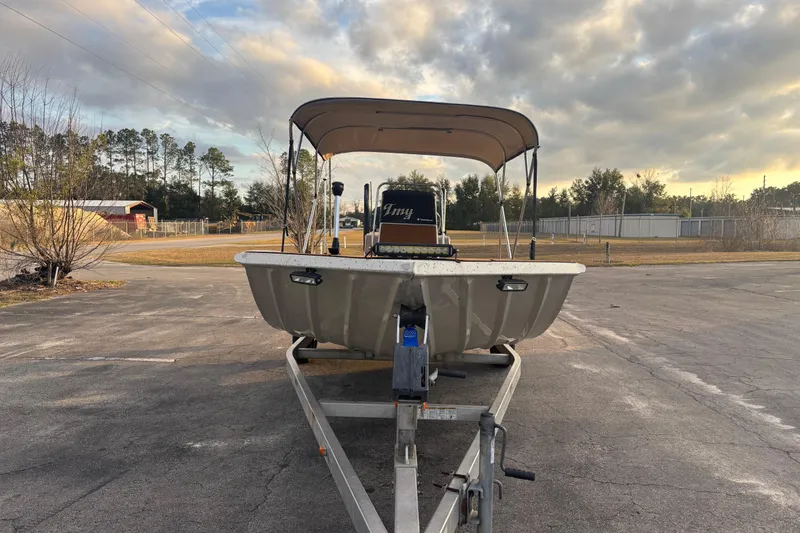 Slide: The Image of 2015 Express XP20CC boat on trailer under cloudy sky. - 16