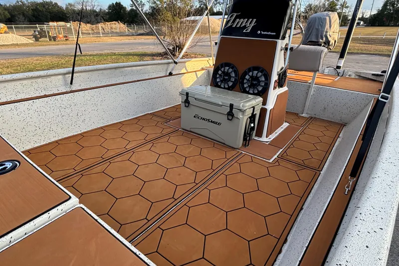 Slide: The Image of 2015 Express XP20CC boat interior with hexagonal flooring and cooler. - 21