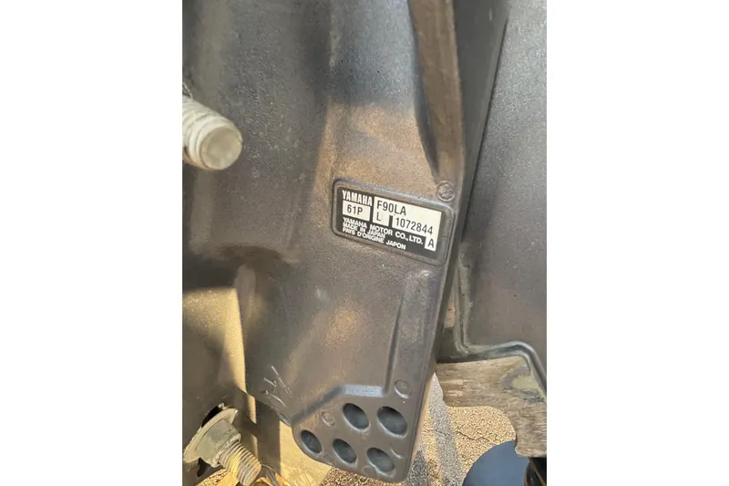 Slide: The Image of Close-up of Yamaha F90LA engine label on 2015 Express XP20CC boat. - 25