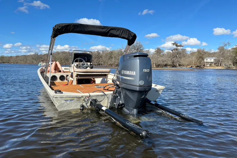 Slide: The Image of 2015 Express XP20CC boat with Yamaha 90 engine on a calm lake. - 5