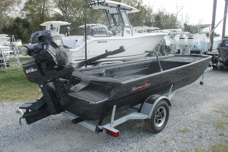 Slide: The Image of 2026 Gator Tail 1854 Extreme boat on trailer, parked outdoors. - 4