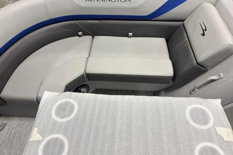Slide: The Image of 2026 Bennington 22SXSR boat interior with gray seating and cup holders. - 4