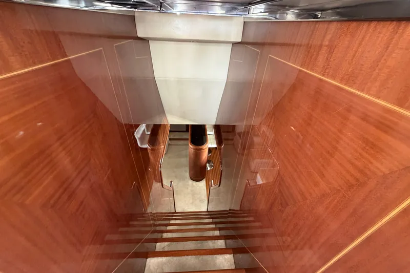 Slide: The Image of Staircase with polished wood finish inside 2004 Mangusta 72 yacht. - 14