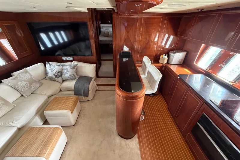 Slide: The Image of Luxurious interior of 2004 Mangusta 72 yacht with elegant wood finishes and plush seating. - 15