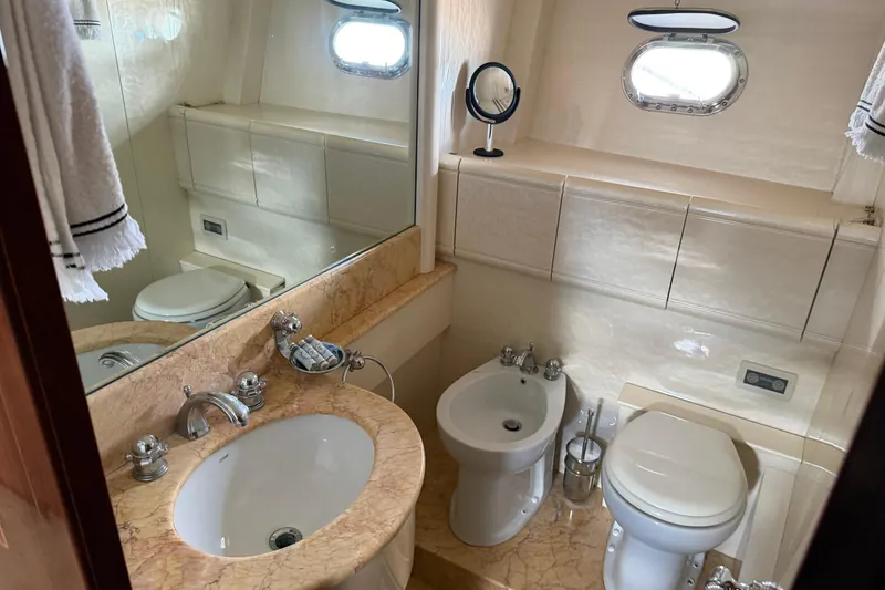 Slide: The Image of Luxurious bathroom in 2004 Mangusta 72 yacht with marble sink and modern fixtures. - 23
