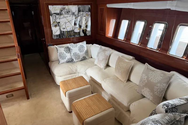 Slide: The Image of Luxurious interior of 2004 Mangusta 72 yacht with plush seating and elegant decor. - 24