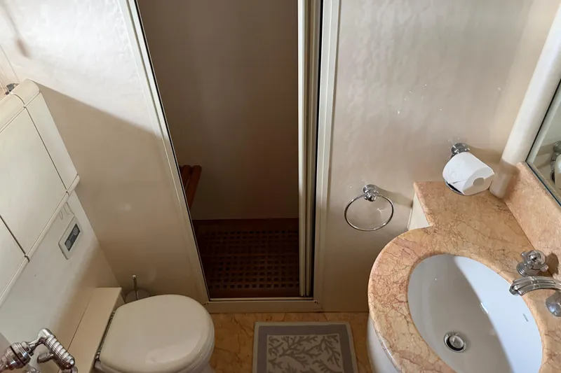 Slide: The Image of Luxurious bathroom in 2004 Mangusta 72 yacht with marble countertop and modern fixtures. - 29