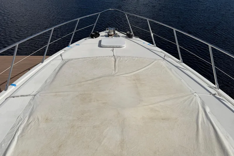 Slide: The Image of Bow view of 2004 Mangusta 72 yacht on calm water. - 35