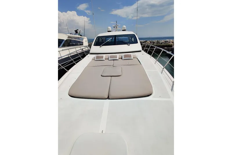 Slide: The Image of Luxurious 2004 Mangusta 72 yacht with spacious sunbathing deck and sleek design. - 40