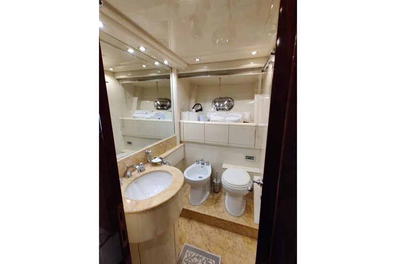 Slide: The Image of Luxurious bathroom interior of 2004 Mangusta 72 yacht with elegant fixtures and lighting. - 41