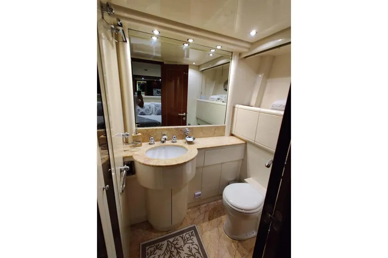 Slide: The Image of Luxurious bathroom in 2004 Mangusta 72 yacht with elegant fixtures and marble countertop. - 48