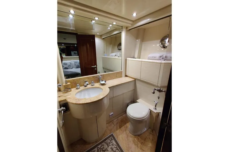 Slide: The Image of Luxurious bathroom in 2004 Mangusta 72 yacht with elegant fixtures and marble countertop. - 49