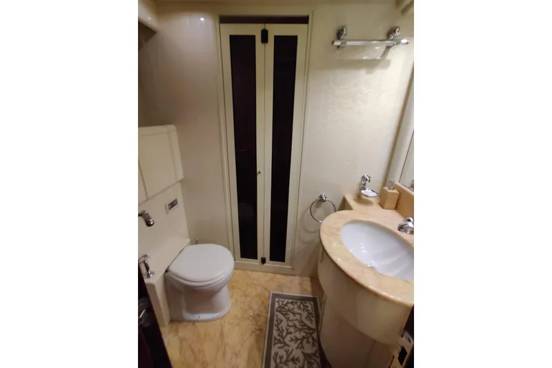 Slide: The Image of Luxurious bathroom in 2004 Mangusta 72 yacht with elegant fixtures and marble countertop. - 50